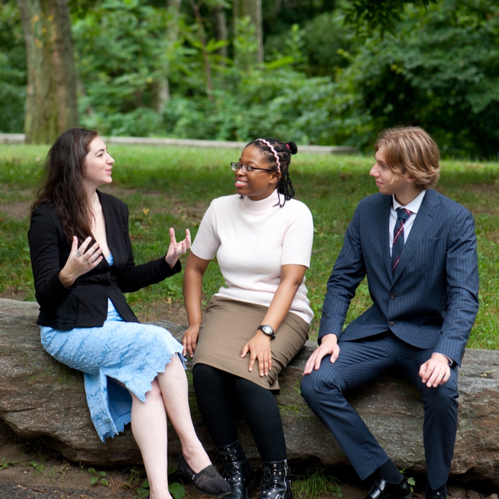 a small group chatting outdoors