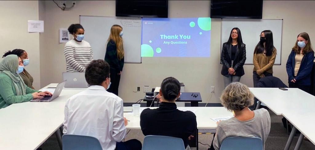 Students in Career Essentials present their Create-A-Company projects to a panel of judges. 