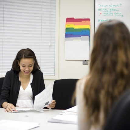 Woman looking at a piece of paper