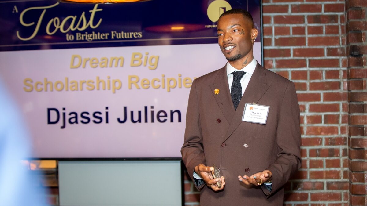 Past scholarship winner Djassi Julien speaks at Toast