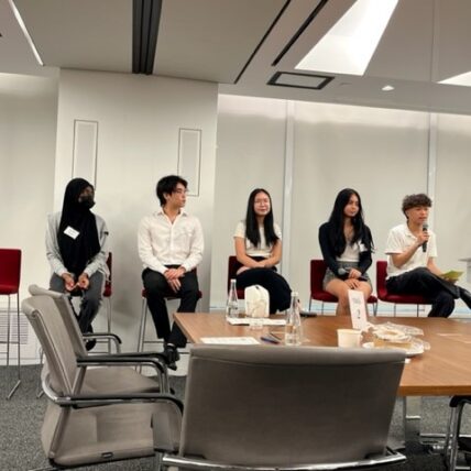 Students speak on a panel