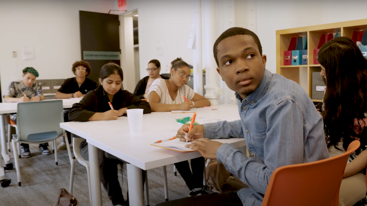 Students sitting at desks during a workshop