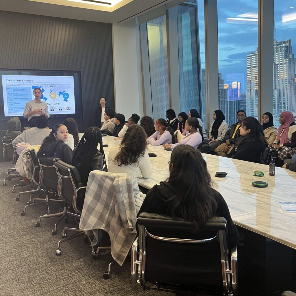 Students listen to a presentation on a career exploration field trip