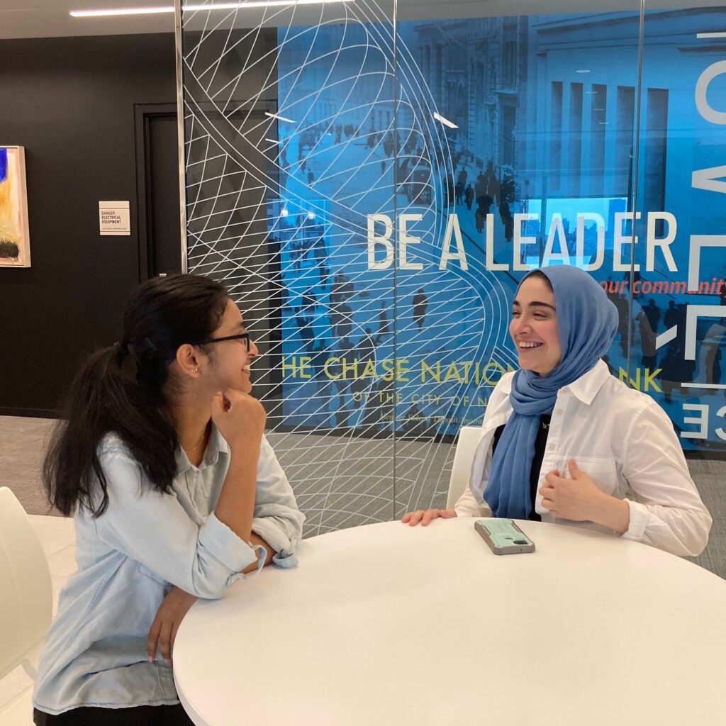 An intern visits with a program coordinator