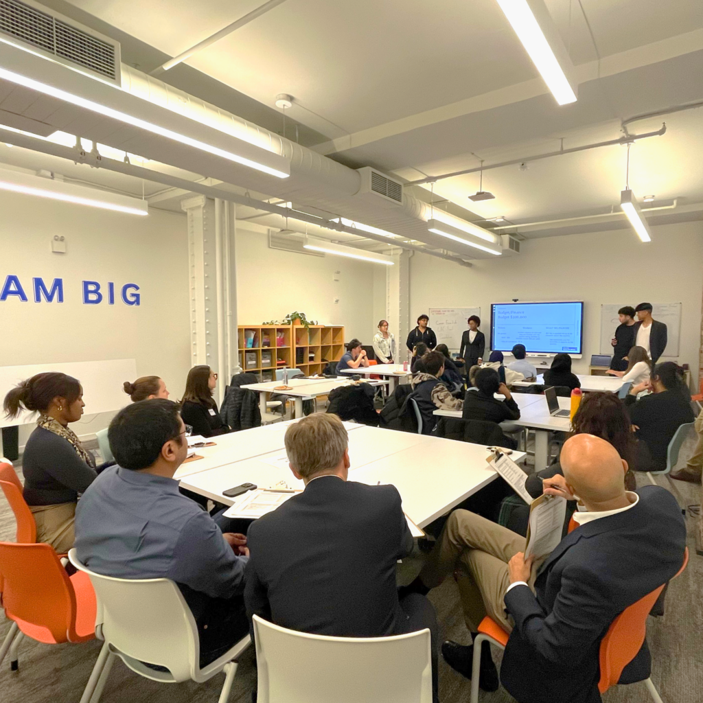 A group of volunteers judges Create-A-Company projects